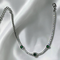Bracelet rivière zircons blancs & vert émeraude sur fond de tissue blanc en acier inoxydable – Jewelry by Kitana