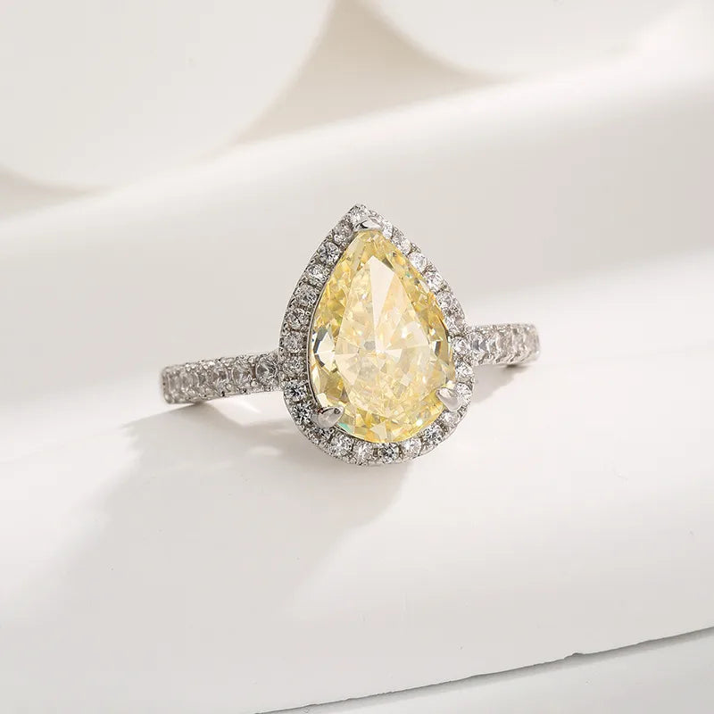 Bague goutte solitaire en acier argenté, pierre jaune facettée