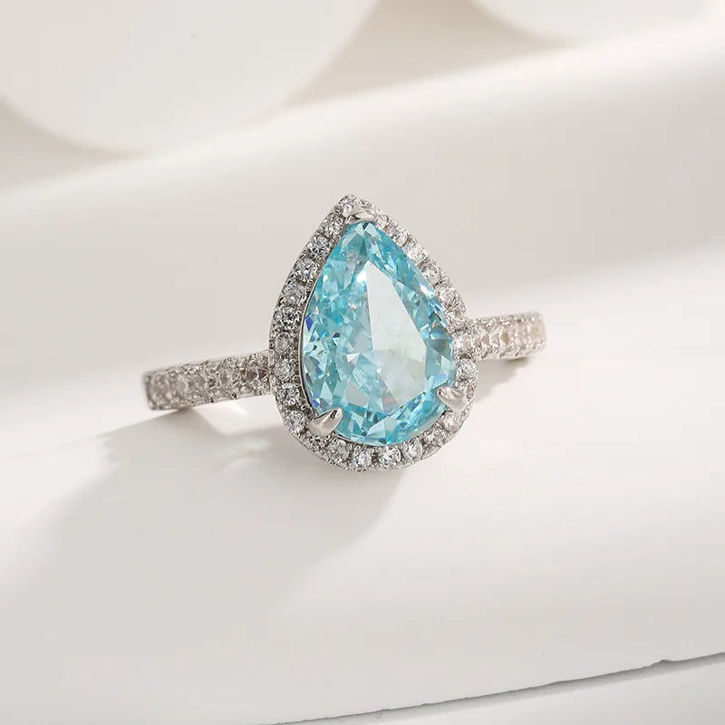 Bague goutte solitaire en acier argenté, pierre bleue facettée