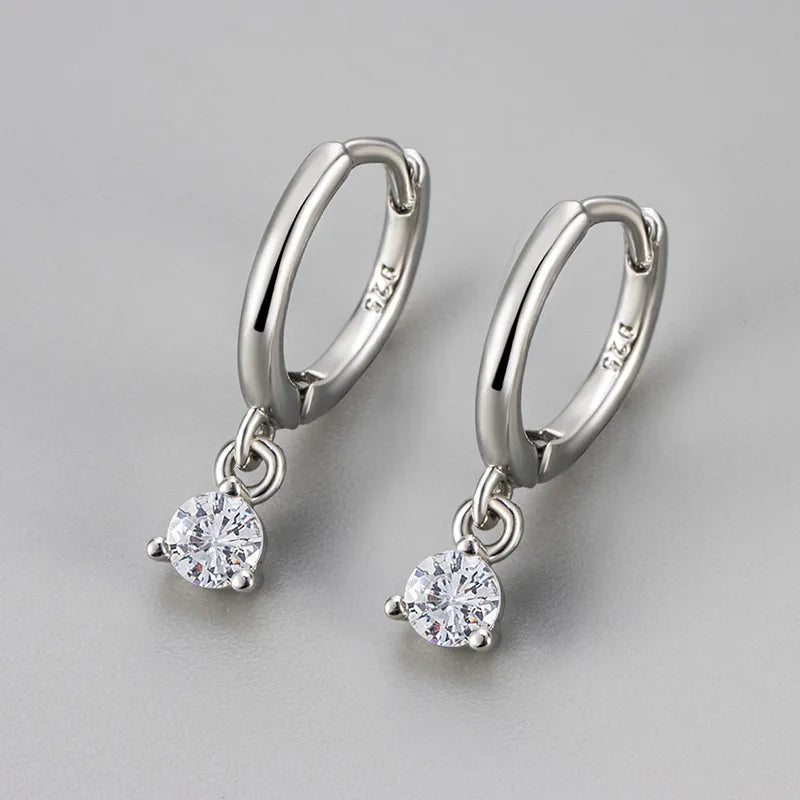 Créoles pendantes argent 925, grands anneaux ovales avec zircon solitaire blanc.