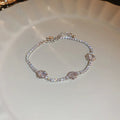 Bracelet rivière argenté à strass et zircons, motif floral en bordure
