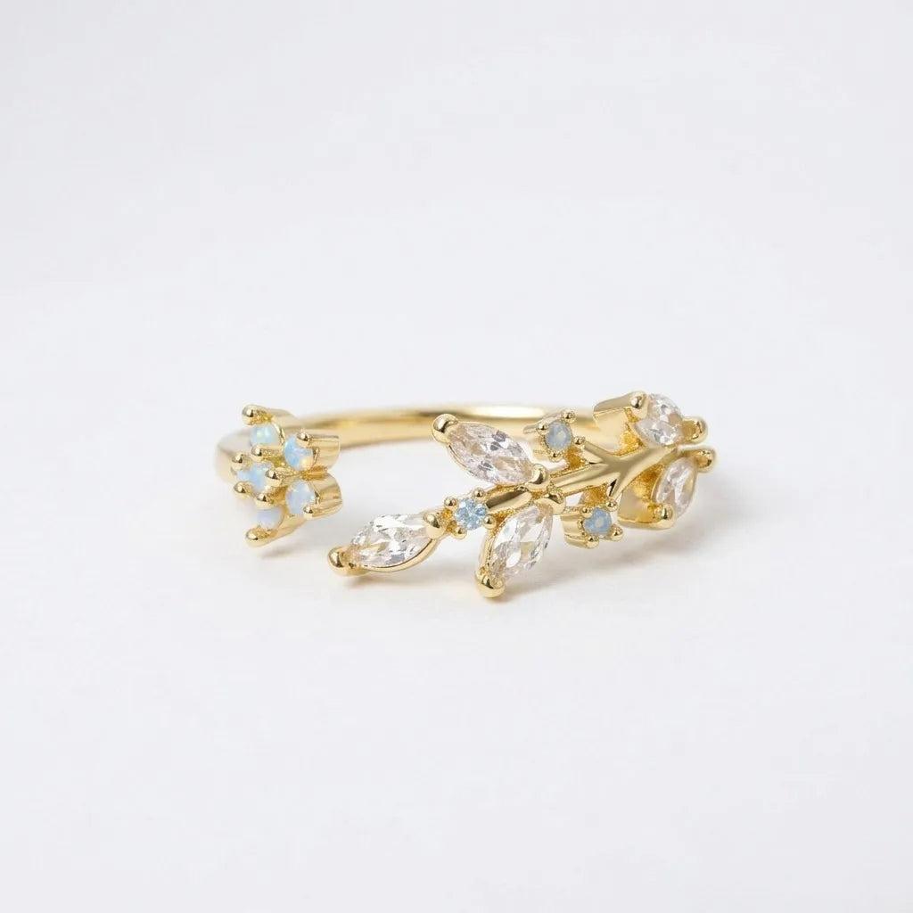 Bague réglable dorée, branche fleurie avec opale et zircons transparents