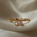 Bague réglable plaquée or 18K, motifs cerise et étoile, pierres roses