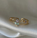 Bague double rang plaquée or, papillon serti de zircon vert pastel et pierres mauves