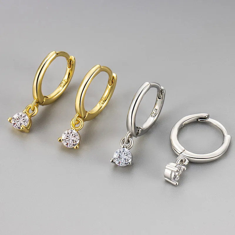 Créoles pendantes argent 925, anneaux ronds avec zircon solitaire blanc.