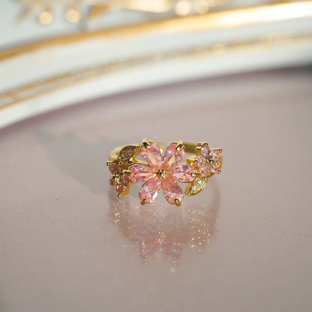 Bague réglable fleur de cerisier rose et feuillage, plaqué or, pierres roses