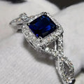 Bague solitaire carrée en acier argenté, halo de pierres, zircon bleu, anneau entrelacé.