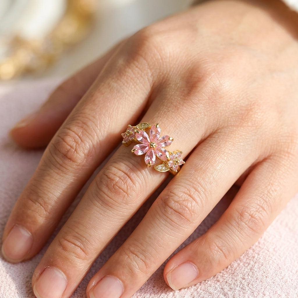 Bague fleur de cerisier sakura ajustable plaquée or 18K portée à la main, grandes pétales zircons rose marquise et feuillage doré — Jewelry by Kitana