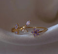 Bague dorée ajustable avec motif floral de zircons violets et pierres scintillantes