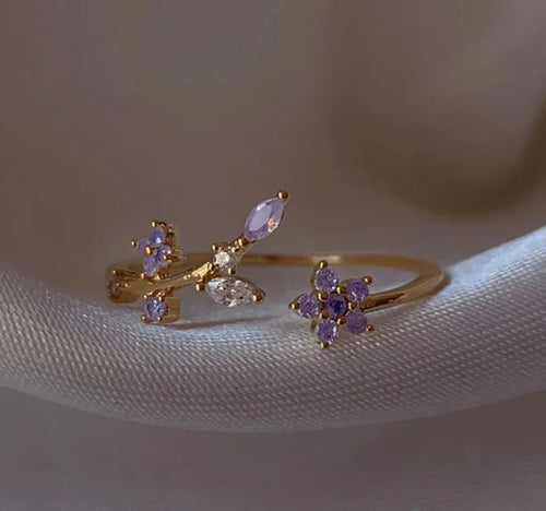 Bague dorée ajustable avec motif floral de zircons violets et pierres scintillantes